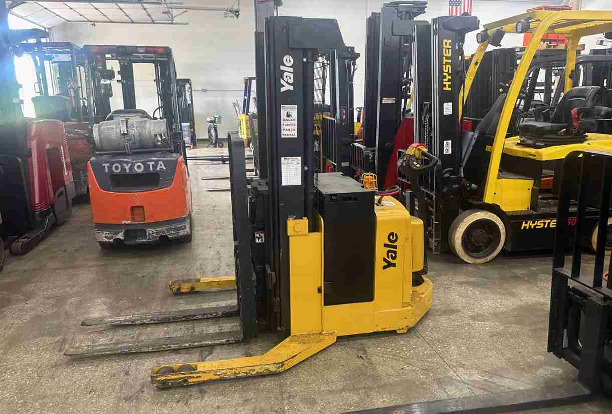Yellow reach truck in warehouse
