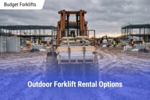 Rear view of an orange rough terrain forklift moving strapped wooden planks and bags of concrete across a rutted, muddy construction jobsite under a cloudy sky.